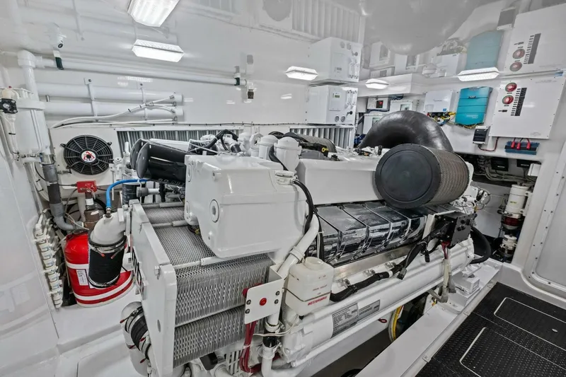 Lady Di Yacht Photos Pics Engine room of 2012 Viking 82 Convertible yacht, showcasing advanced machinery and equipment.