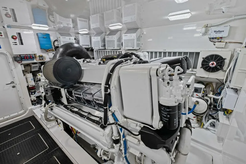 Lady Di Yacht Photos Pics Engine room of 2012 Viking 82 Convertible yacht, showcasing advanced machinery and equipment.