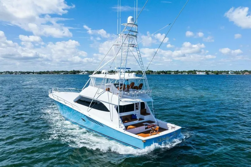 Lady Di Yacht Photos Pics 2012 Viking 82 Convertible yacht cruising on blue ocean under clear sky.