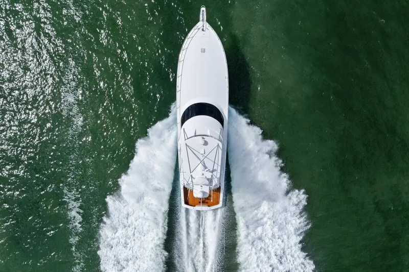 Lady Di Yacht Photos Pics Aerial view of 2012 Viking 82 Convertible yacht cruising on green water.