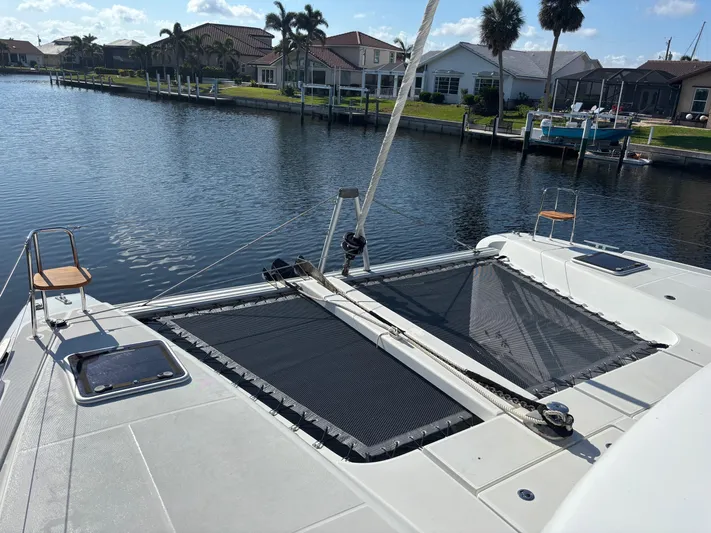 Gone Again Yacht Photos Pics Lagoon 42 catamaran (2019) docked in a scenic waterfront neighborhood.