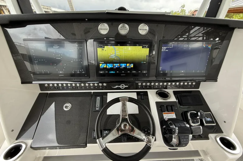  Yacht Photos Pics 2021 Fountain 43 NX boat dashboard with advanced navigation screens and controls.