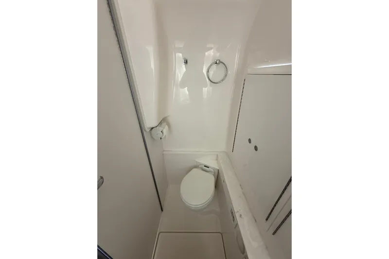  Yacht Photos Pics 2021 Fountain 43 NX boat bathroom interior with toilet and towel ring.