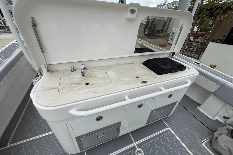  Yacht Photos Pics Outdoor kitchen on 2021 Fountain 43 NX boat with sink and grill.