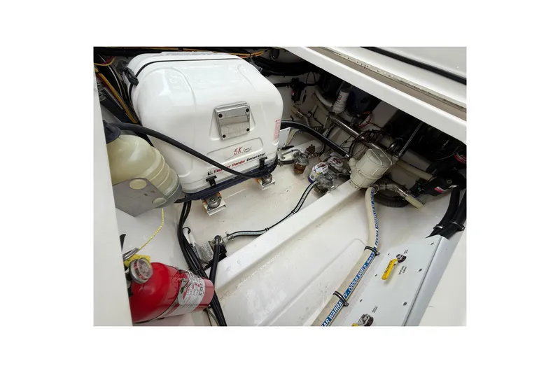  Yacht Photos Pics Engine compartment of 2021 Fountain 43 NX boat with generator and fire extinguisher.