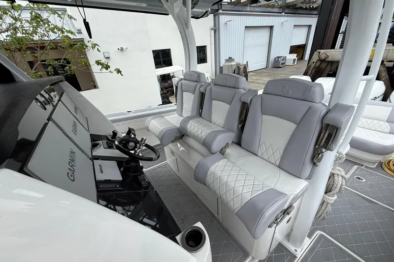  Yacht Photos Pics Luxury seating and helm of 2021 Fountain 43 NX boat with Garmin navigation system.