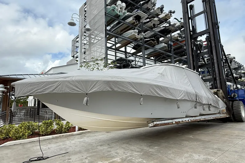  Yacht Photos Pics 2021 Fountain 43 NX boat covered and lifted in a storage facility.