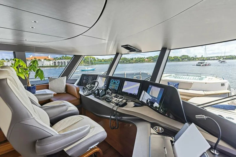 Lady Lion Yacht Photos Pics Luxurious 2023 Princess X95 yacht interior with modern helm and scenic ocean view.