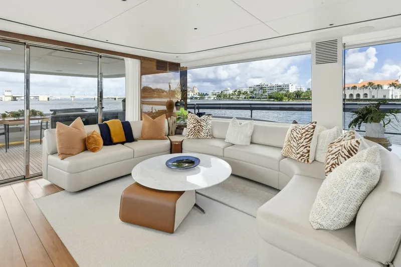 Lady Lion Yacht Photos Pics Luxurious 2023 Princess X95 yacht interior with elegant seating and scenic waterfront views.