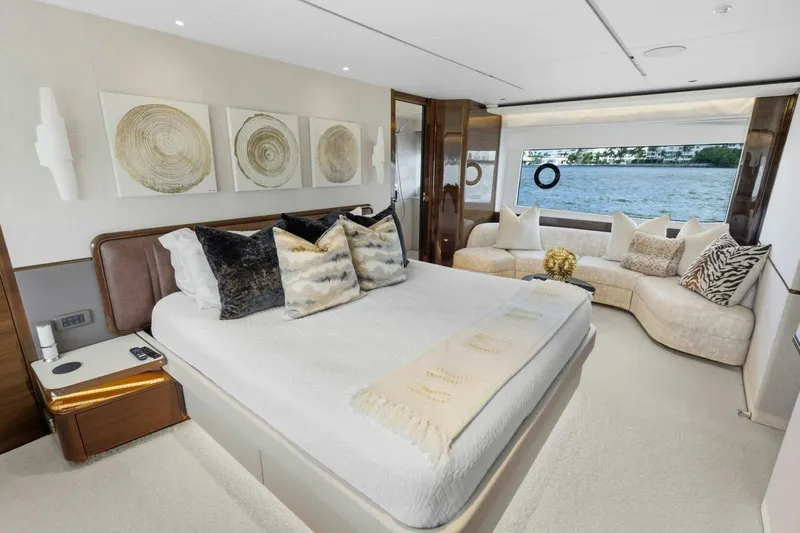 Lady Lion Yacht Photos Pics Luxurious 2023 Princess X95 yacht bedroom with elegant decor and scenic window view.