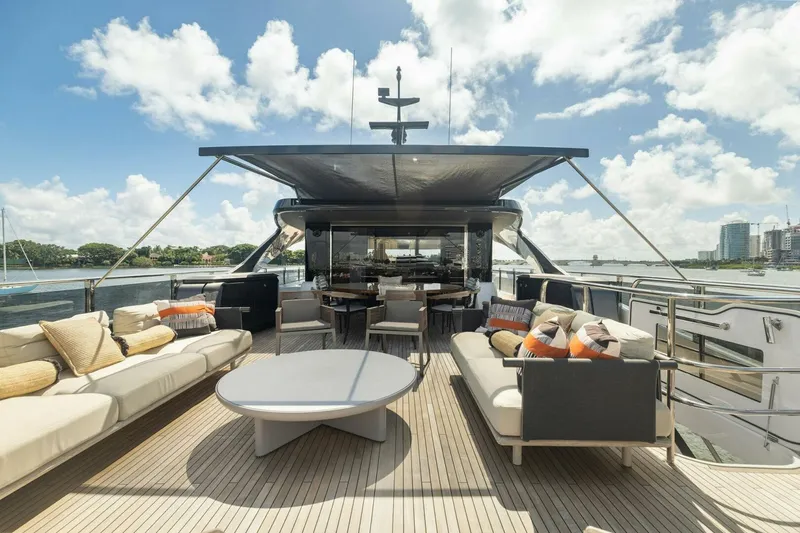 Lady Lion Yacht Photos Pics Luxurious 2023 Princess X95 yacht deck with elegant seating and stunning waterfront views.
