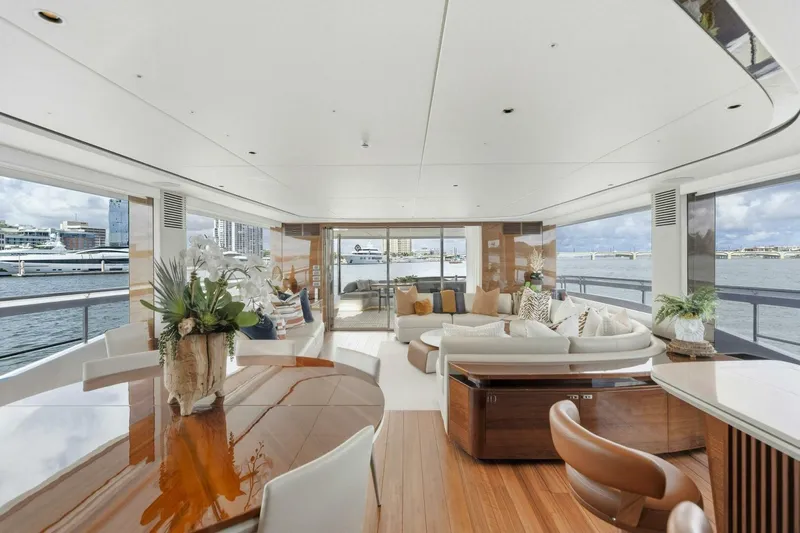 Lady Lion Yacht Photos Pics Luxurious interior of 2023 Princess X95 yacht with elegant seating and panoramic ocean views.