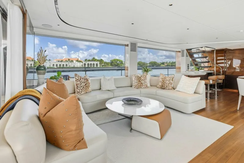 Lady Lion Yacht Photos Pics Luxurious interior of 2023 Princess X95 yacht with elegant seating and scenic water views.