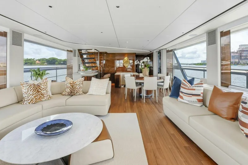 Lady Lion Yacht Photos Pics Luxurious interior of 2023 Princess X95 yacht with elegant seating and dining area.