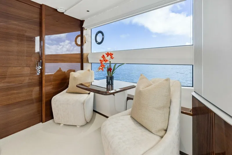 Lady Lion Yacht Photos Pics Luxurious interior of 2023 Princess X95 yacht with ocean view and elegant seating.