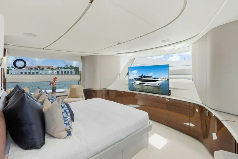 Lady Lion Yacht Photos Pics Luxurious interior of 2023 Princess X95 yacht with elegant bedroom and scenic window view.
