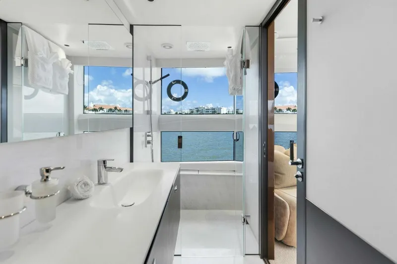 Lady Lion Yacht Photos Pics Luxurious bathroom on 2023 Princess X95 yacht with ocean view and modern amenities.