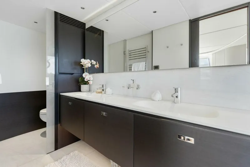 Lady Lion Yacht Photos Pics Luxurious bathroom in 2023 Princess X95 yacht with dual sinks and modern decor.