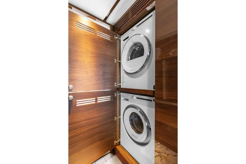 Lady Lion Yacht Photos Pics Laundry area with stacked washer and dryer in 2023 Princess X95 yacht.