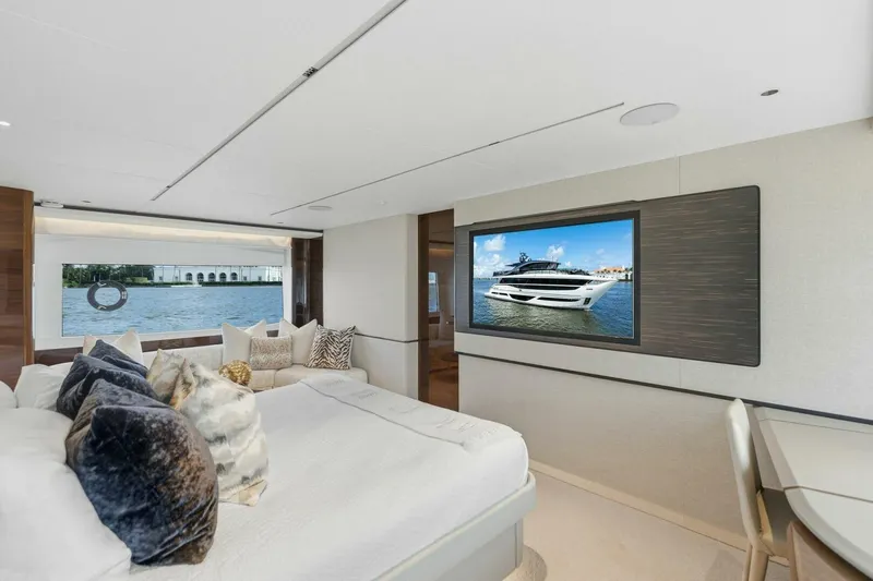 Lady Lion Yacht Photos Pics Luxurious interior of 2023 Princess X95 yacht with elegant bedroom and scenic window view.