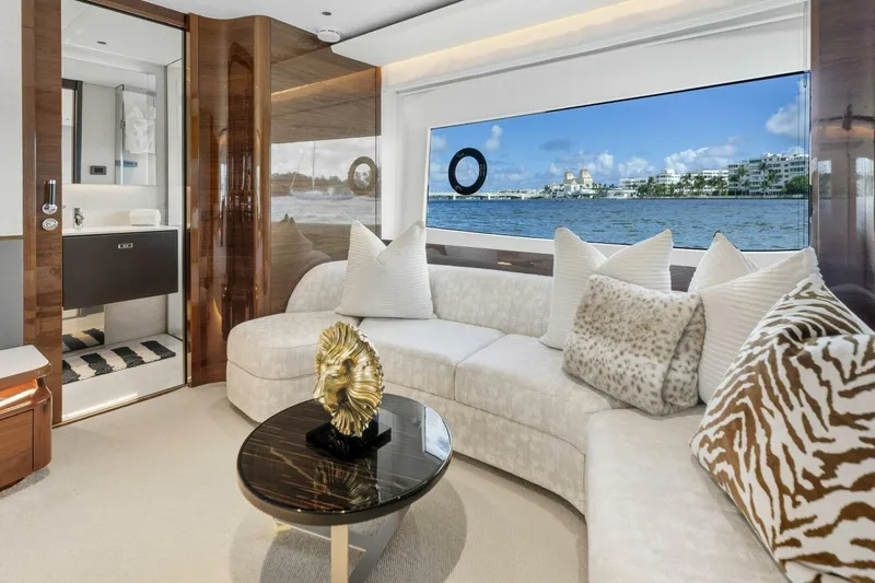 Lady Lion Yacht Photos Pics Luxurious interior of 2023 Princess X95 yacht with elegant seating and scenic ocean view.