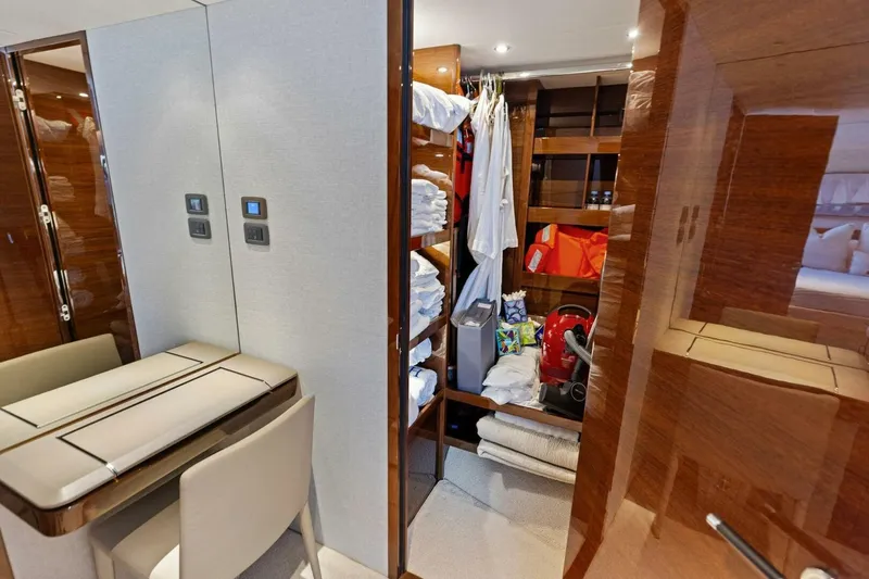 Lady Lion Yacht Photos Pics Luxurious 2023 Princess X95 yacht interior with storage and vanity area.