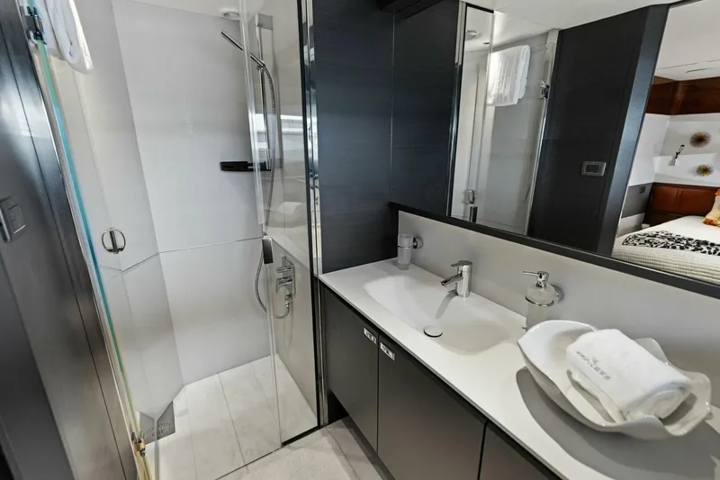 Lady Lion Yacht Photos Pics Luxurious bathroom in 2023 Princess X95 yacht with modern fixtures and elegant design.