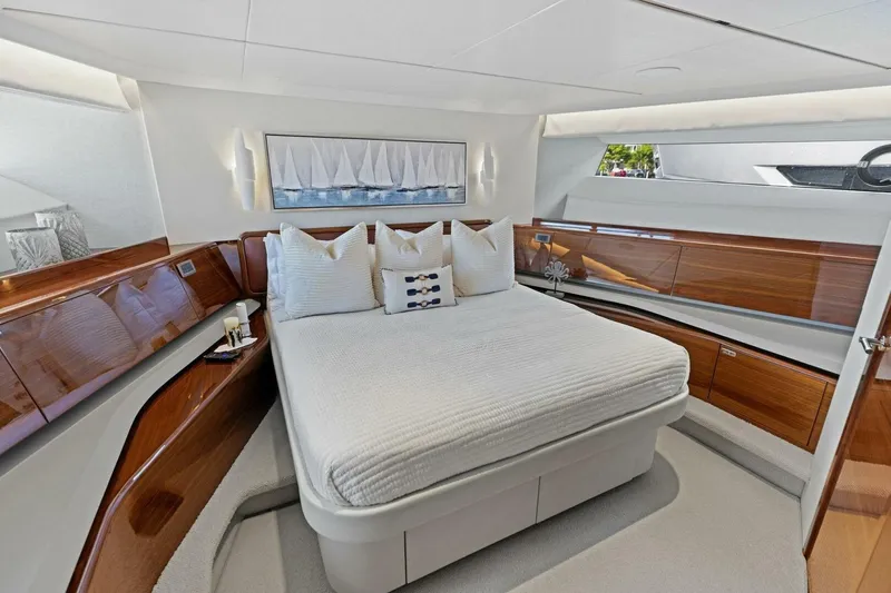 Lady Lion Yacht Photos Pics Luxurious bedroom interior of 2023 Princess X95 yacht with elegant wood finishes.