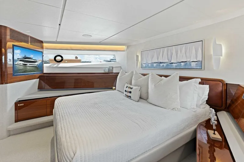 Lady Lion Yacht Photos Pics Luxurious bedroom interior of 2023 Princess X95 yacht with elegant decor and modern amenities.