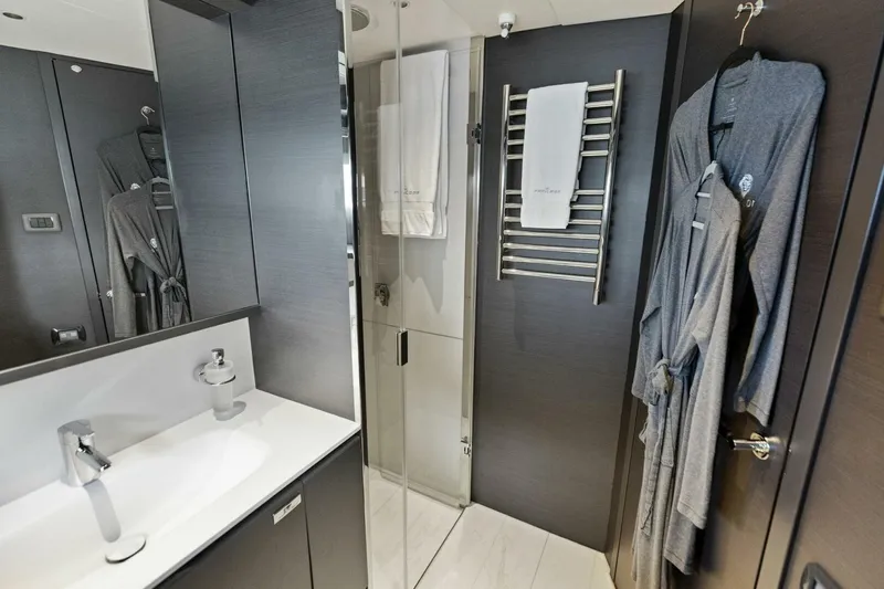 Lady Lion Yacht Photos Pics Luxurious bathroom in 2023 Princess X95 yacht with modern fixtures and elegant robes.