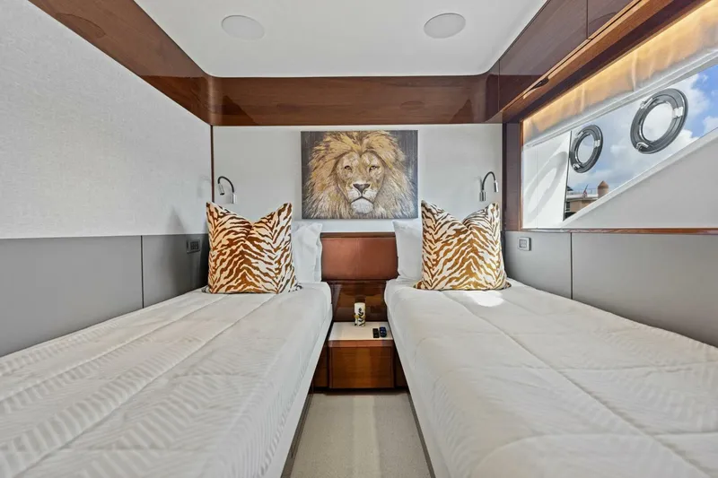 Lady Lion Yacht Photos Pics Luxurious 2023 Princess X95 yacht cabin with twin beds and lion artwork.