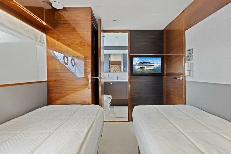 Lady Lion Yacht Photos Pics Luxurious 2023 Princess X95 yacht cabin with twin beds and modern amenities.