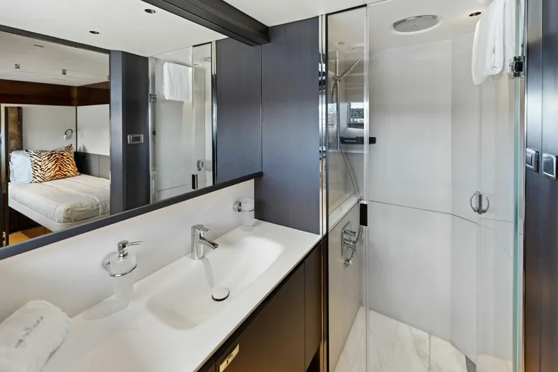 Lady Lion Yacht Photos Pics Luxurious bathroom in 2023 Princess X95 yacht with modern fixtures and spacious shower.