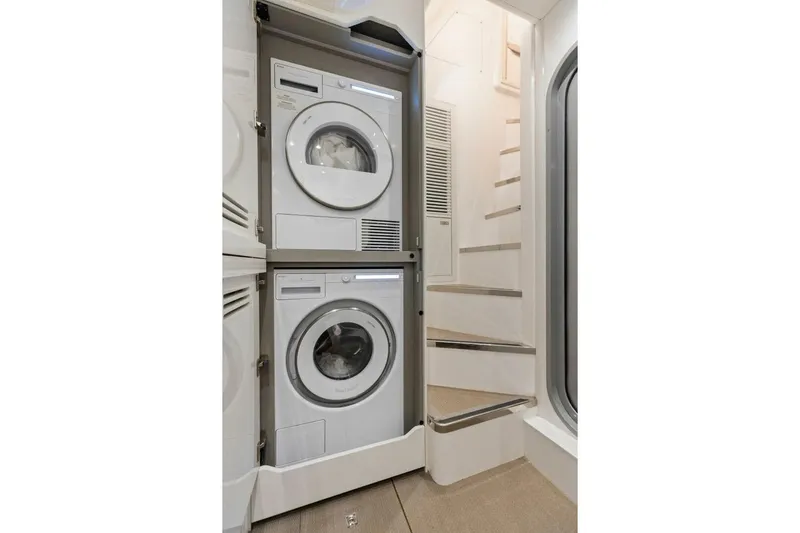 Lady Lion Yacht Photos Pics Laundry area with stacked washer and dryer in 2023 Princess X95 yacht.