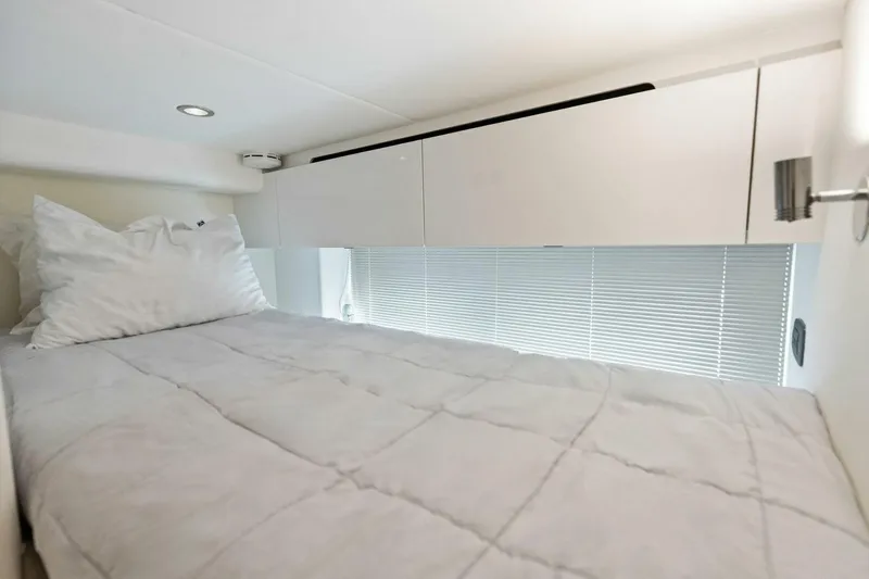 Lady Lion Yacht Photos Pics Luxurious 2023 Princess X95 yacht cabin with cozy bedding and modern design.