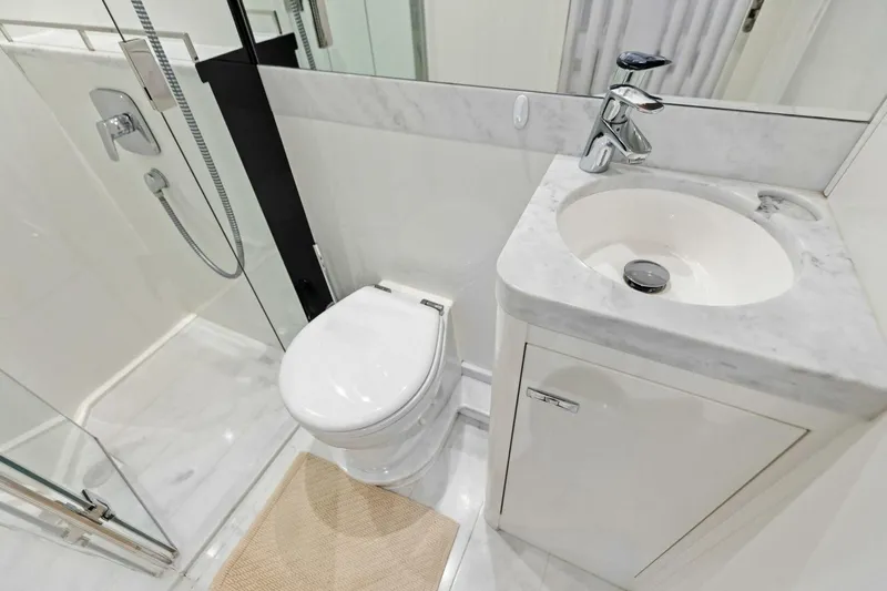 Lady Lion Yacht Photos Pics Luxurious bathroom in 2023 Princess X95 yacht with modern fixtures and marble accents.