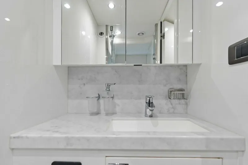 Lady Lion Yacht Photos Pics Luxurious bathroom sink with marble countertop on 2023 Princess X95 yacht.