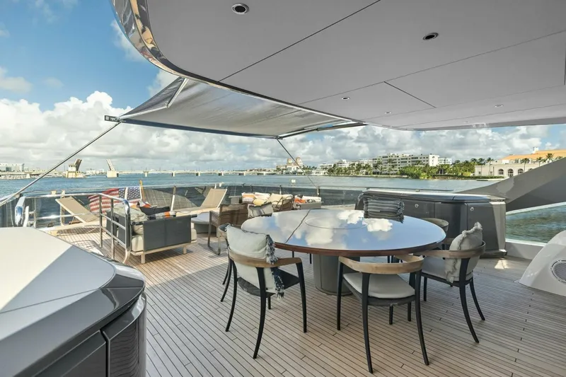 Lady Lion Yacht Photos Pics Luxurious 2023 Princess X95 yacht deck with elegant seating and stunning waterfront views.