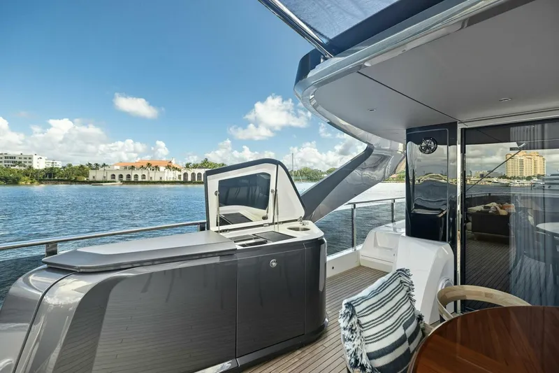 Lady Lion Yacht Photos Pics Luxurious 2023 Princess X95 yacht deck with stunning waterfront view.