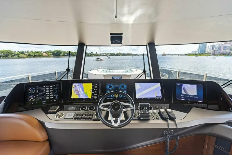 Lady Lion Yacht Photos Pics Luxurious 2023 Princess X95 yacht helm with advanced navigation systems and panoramic water views.
