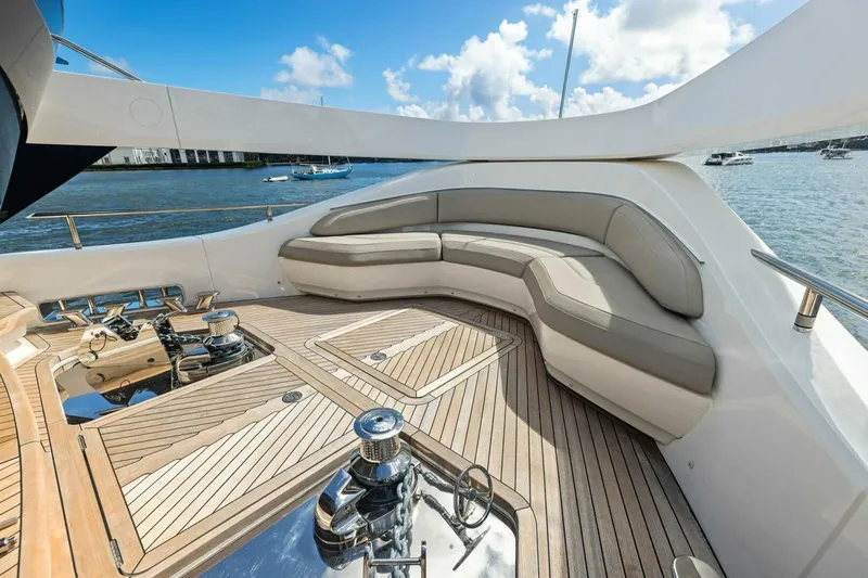 Lady Lion Yacht Photos Pics Luxurious 2023 Princess X95 yacht deck with elegant seating and scenic ocean view.
