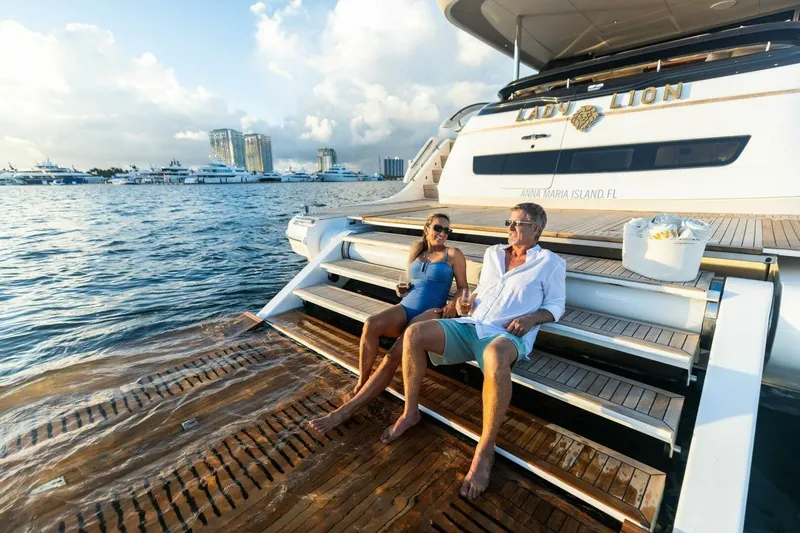 Lady Lion Yacht Photos Pics Couple relaxing on 2023 Princess X95 yacht, enjoying ocean view.