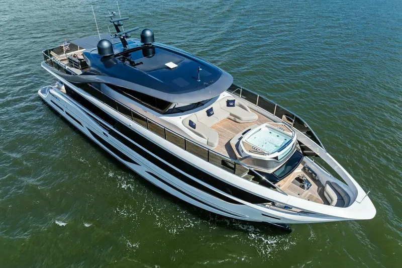 Lady Lion Yacht Photos Pics Luxurious 2023 Princess X95 yacht cruising on open water, featuring sleek design and spacious deck.