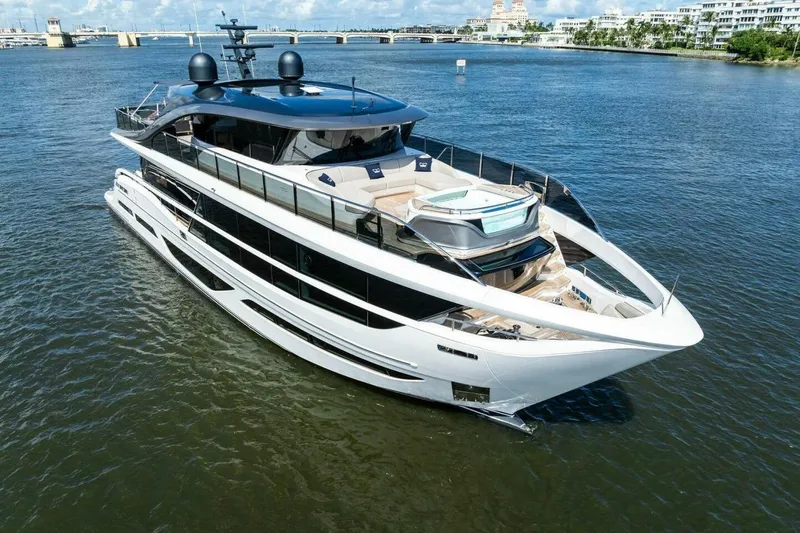 Lady Lion Yacht Photos Pics Luxurious 2023 Princess X95 yacht cruising on a sunny day, showcasing sleek design and elegance.