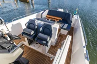 2023 Nimbus T9 X-Edition boat interior with seating and wooden deck.