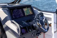 2023 Nimbus T9 X-Edition boat dashboard with steering wheel and navigation screens.