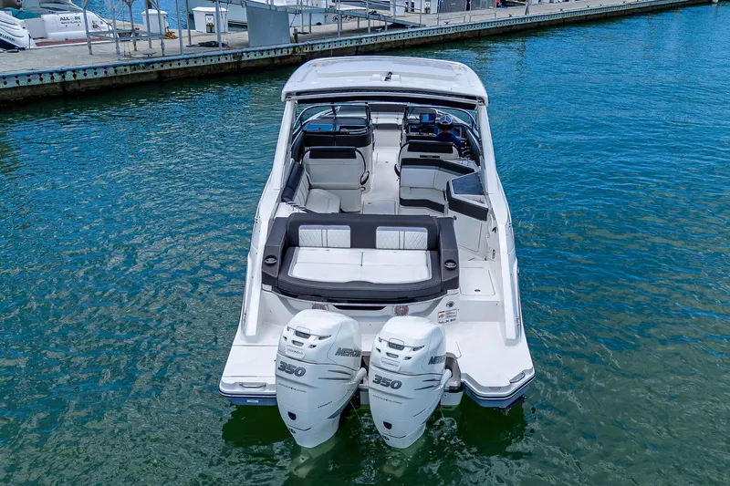  Yacht Photos Pics 2017 Sea Ray 31 SLX boat with twin outboard engines docked in marina.