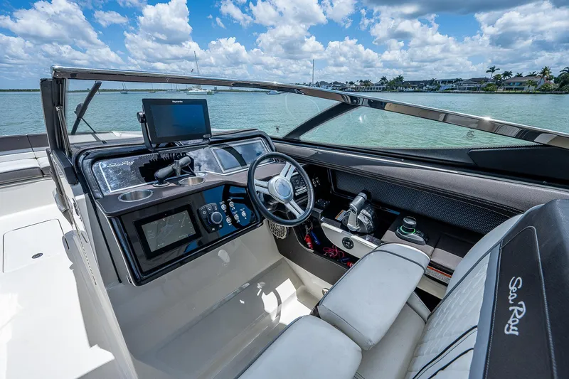  Yacht Photos Pics 2017 Sea Ray 31 SLX boat cockpit with modern controls and waterfront view.