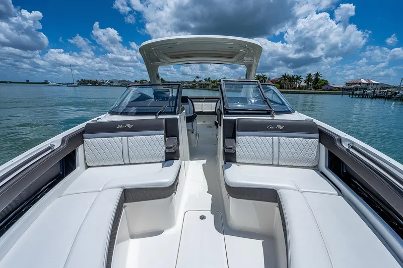  Yacht Photos Pics 2017 Sea Ray 31 SLX boat interior with luxurious seating on a sunny day.
