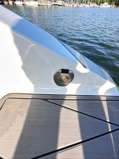  Yacht Photos Pics 2023 Statement 350 Open boat detail by the water, showcasing sleek design and craftsmanship.